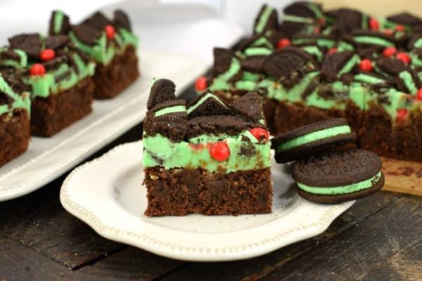 Thick and fudgy Chocolate Brownies. Grinch brownies with a green mint ganache, mint Oreos, and red hot candies! Perfect for Christmas.