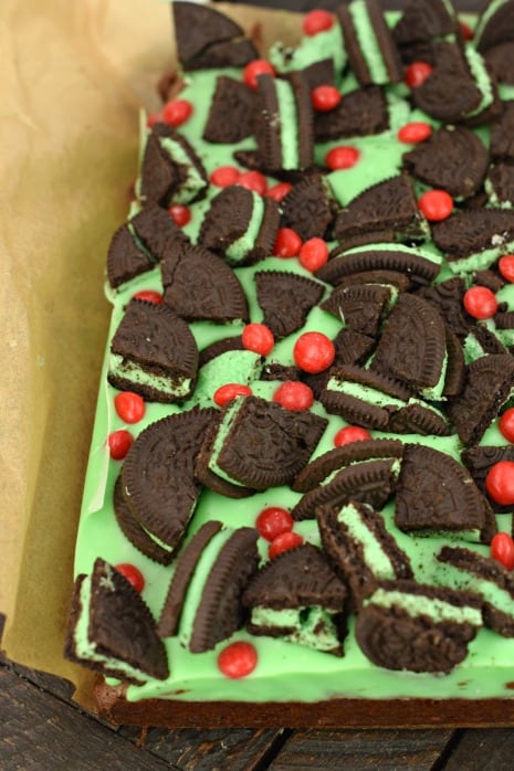 Thick and fudgy Chocolate Brownies. Grinch brownies with a green mint ganache, mint Oreos, and red hot candies! Perfect for Christmas.