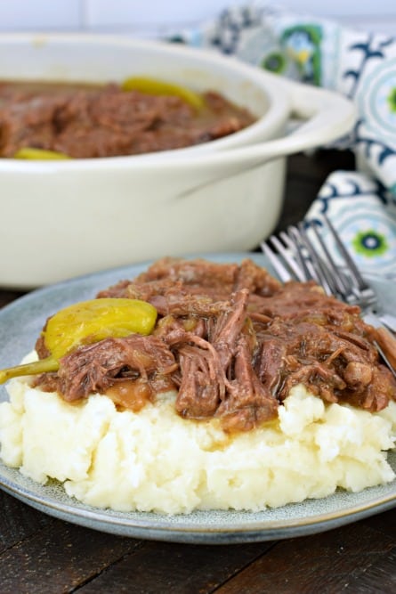 Mississippi Pot Roast on a pile of mashed potatoes