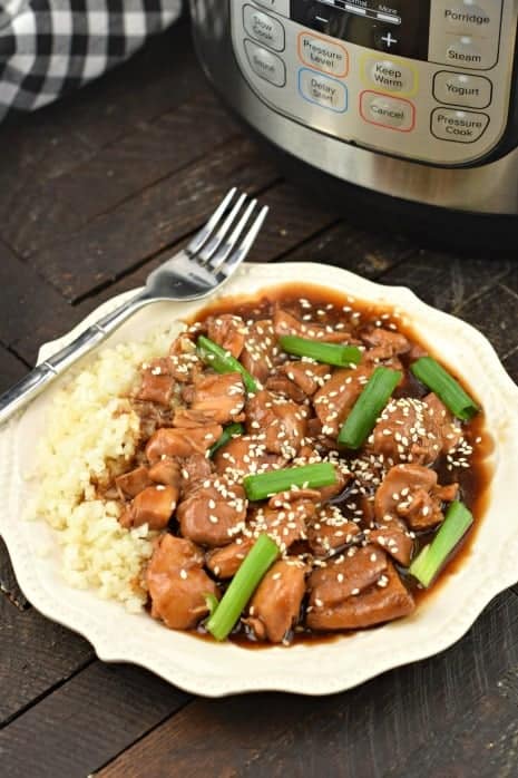 Plate of mongolian chicken made in the pressure cooker and served with rice.