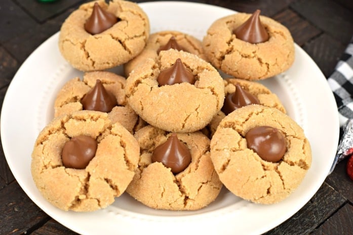 White plate with peanut butter kiss cookies.