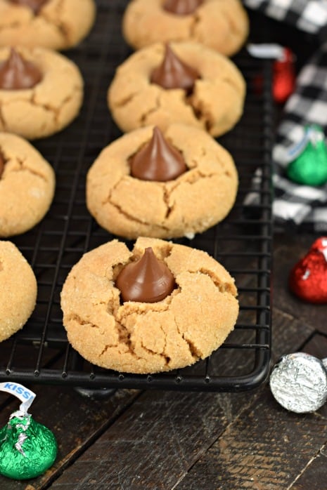 Wire rack with peanut butter cookies and hershey kiss.