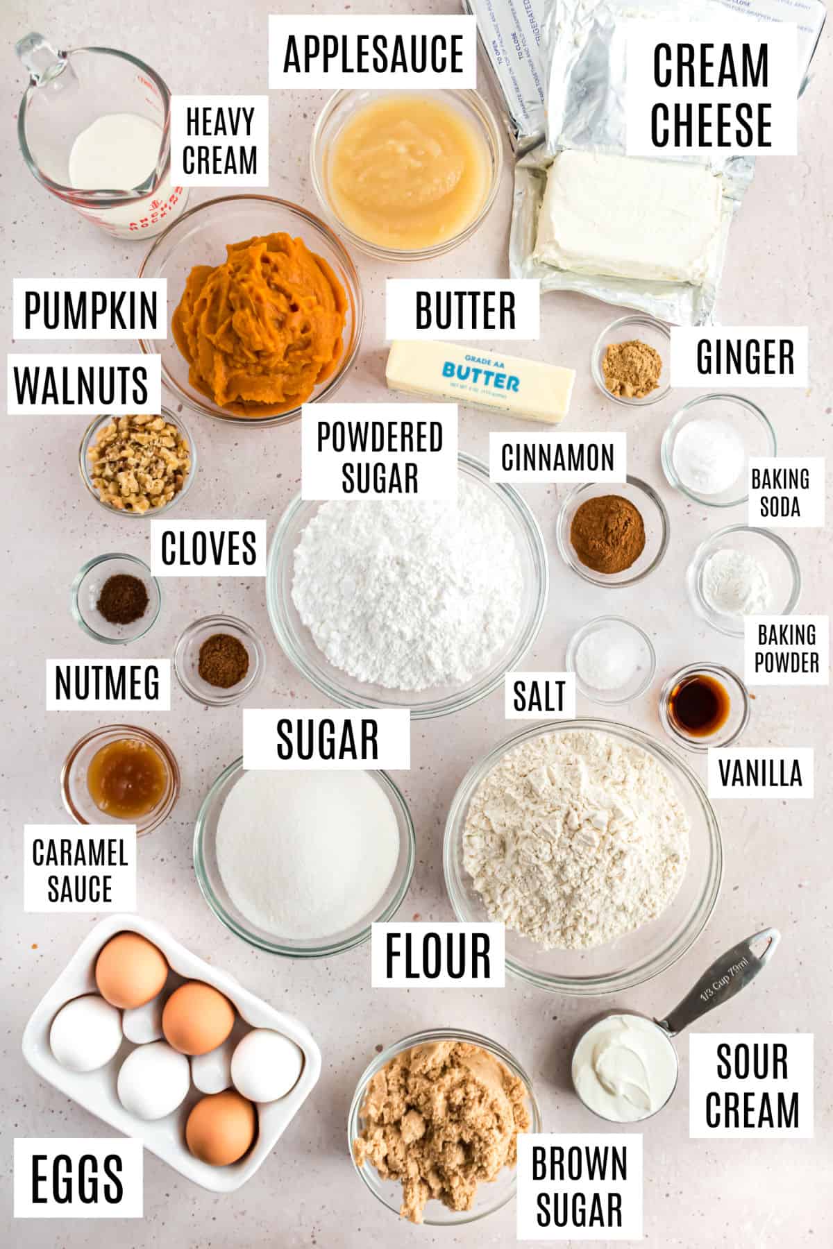 Ingredients needed to make pumpkin cheesecake cake.