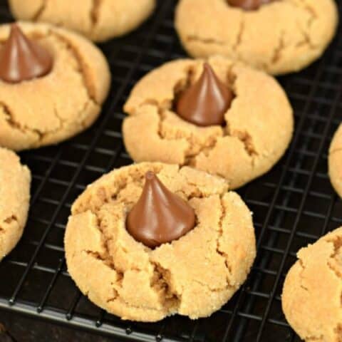 Peanut butter blossom cookies on a wire rack.