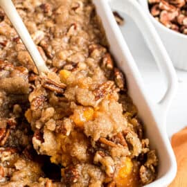 Sweet potato casserole baked in a white dish.