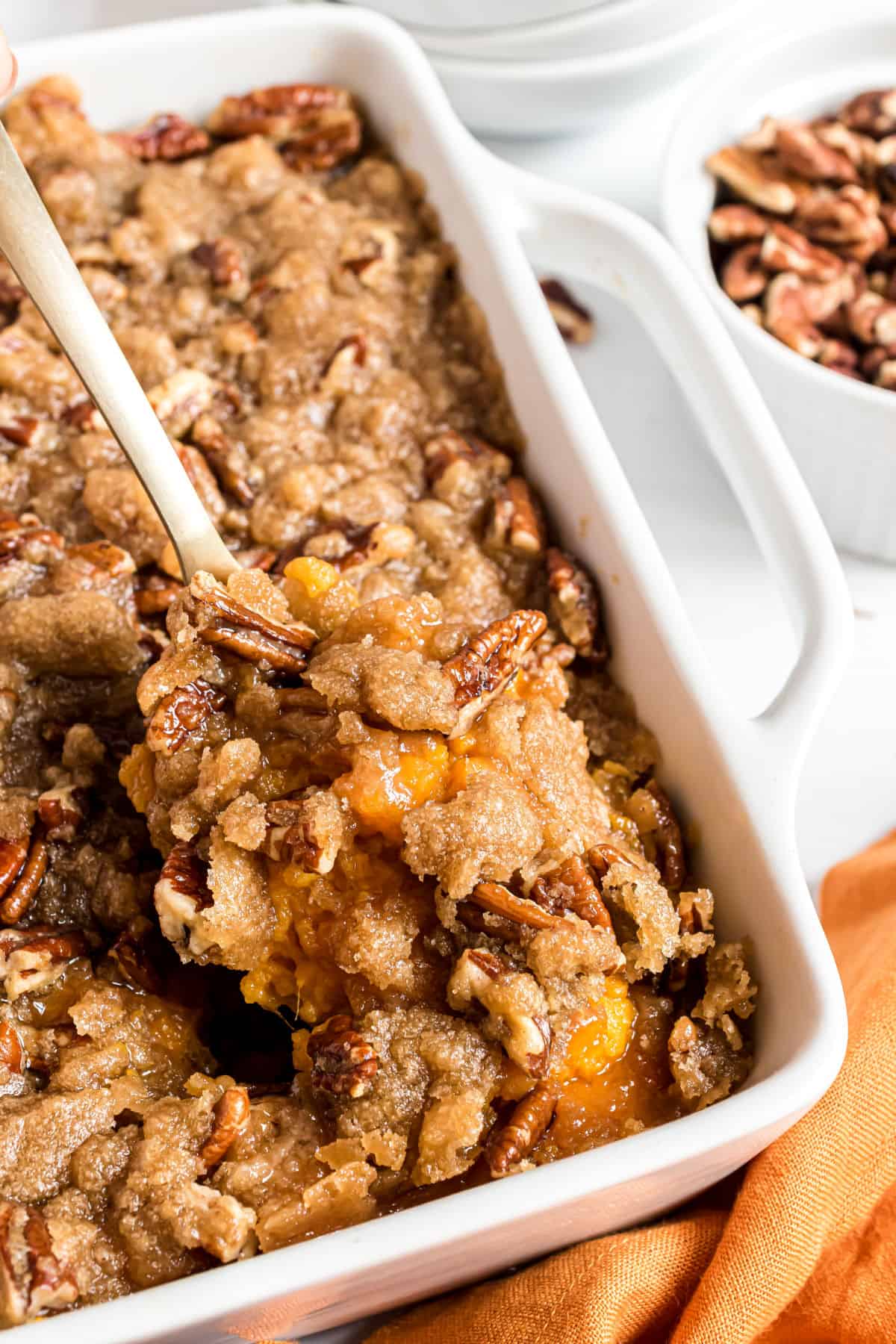 Sweet potato casserole baked in a white dish.