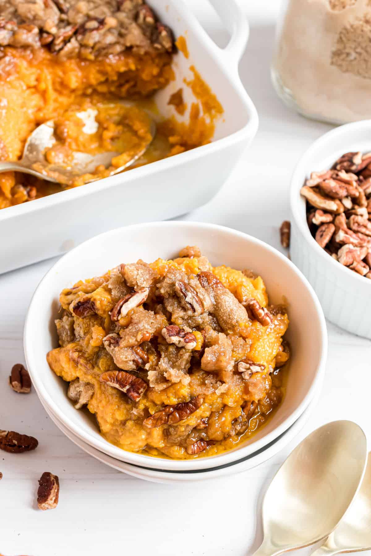 Sweet potato casserole recipe served in white bowls.