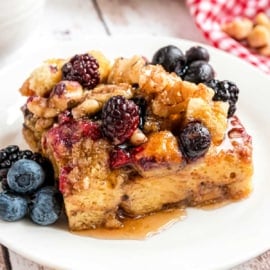 This EASY Berry Walnut French Toast Casserole recipe is made with Brioche Bread and topped with a sugared walnut and berry mixture for extra flavor! Bake it immediately, or make it ahead and refrigerate overnight.