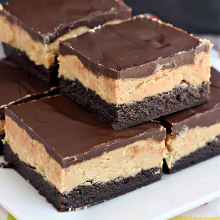 These Buckeye Brownies are amazing! Rich chocolate brownies topped with a homemade peanut butter filling and chocolate ganache.