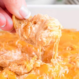 Cheesy creamy Buffalo Chicken Dip is the perfect game day snack. This easy recipe is a family classic, and you'll find yourself wishing you doubled the recipe!