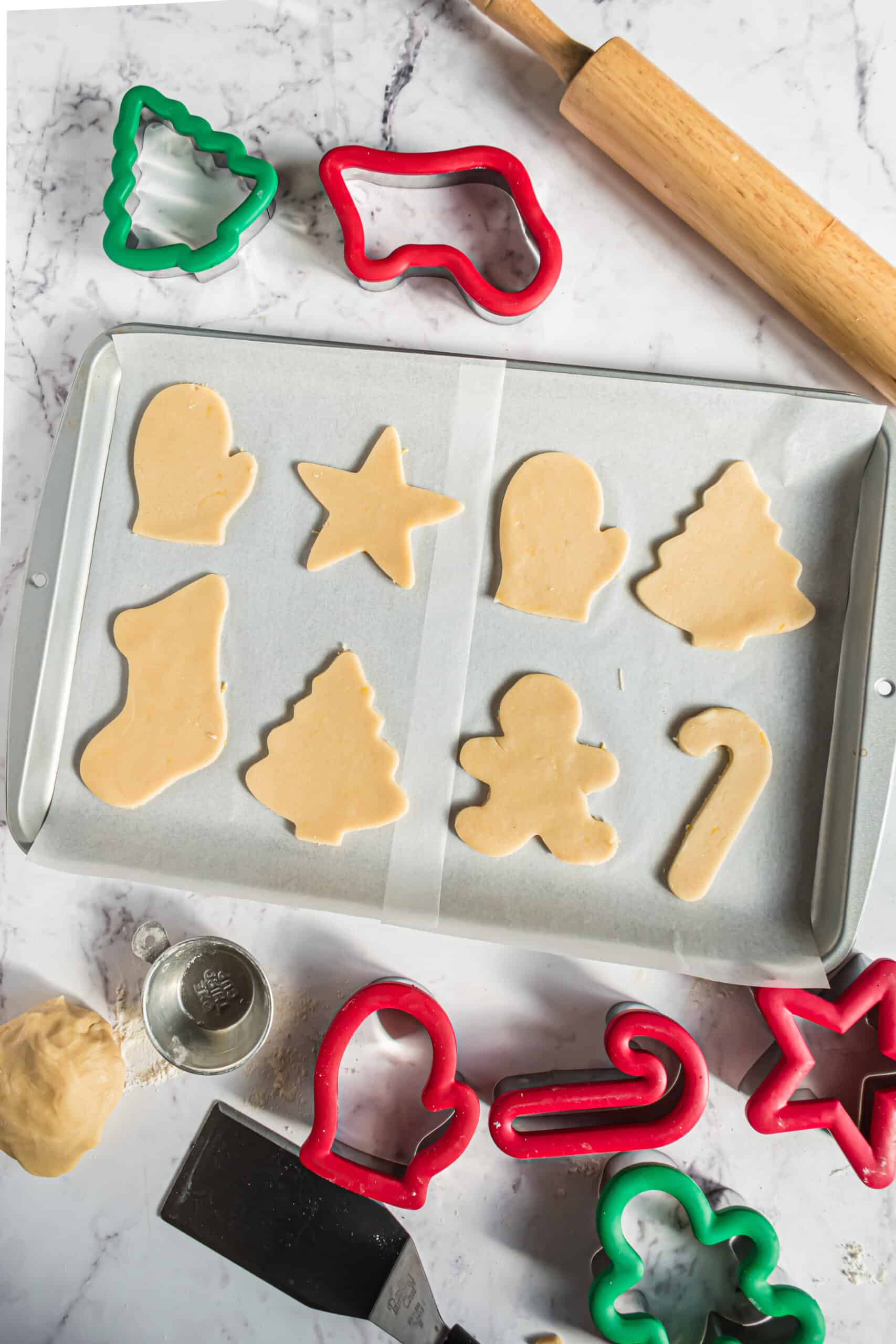 Cut out sugar cookies for Christmas.