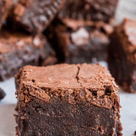 Large square of thick fudgy homemade brownies.