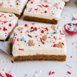 Hate making cutout gingerbread cookies? These Gingerbread Cookie Bars are soft and chewy and topped with a thick, delicious cream cheese frosting. Whip up a batch this holiday season!