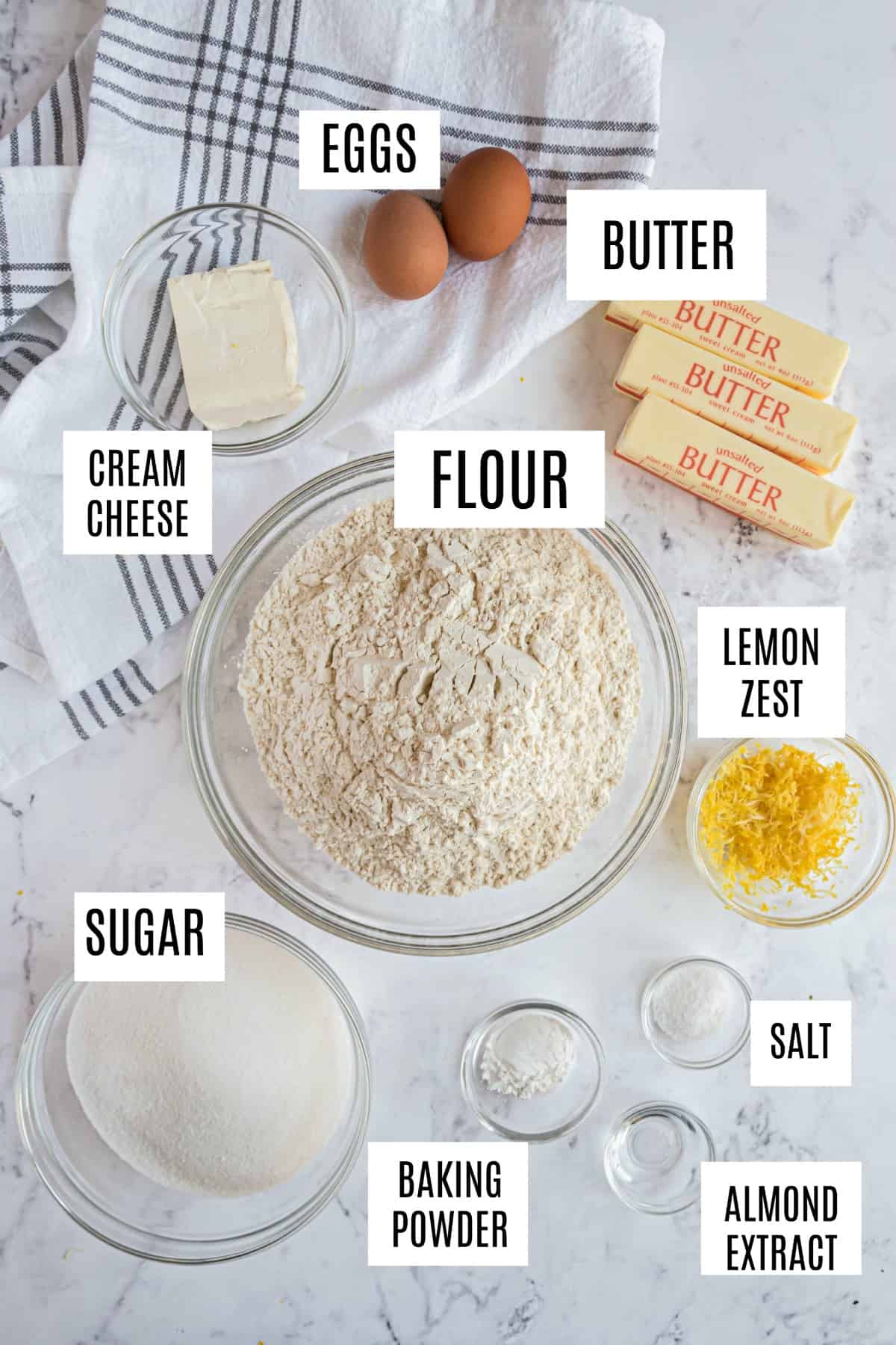 Ingredients needed for cut out sugar cookies including butter, cream cheese, and sugar.