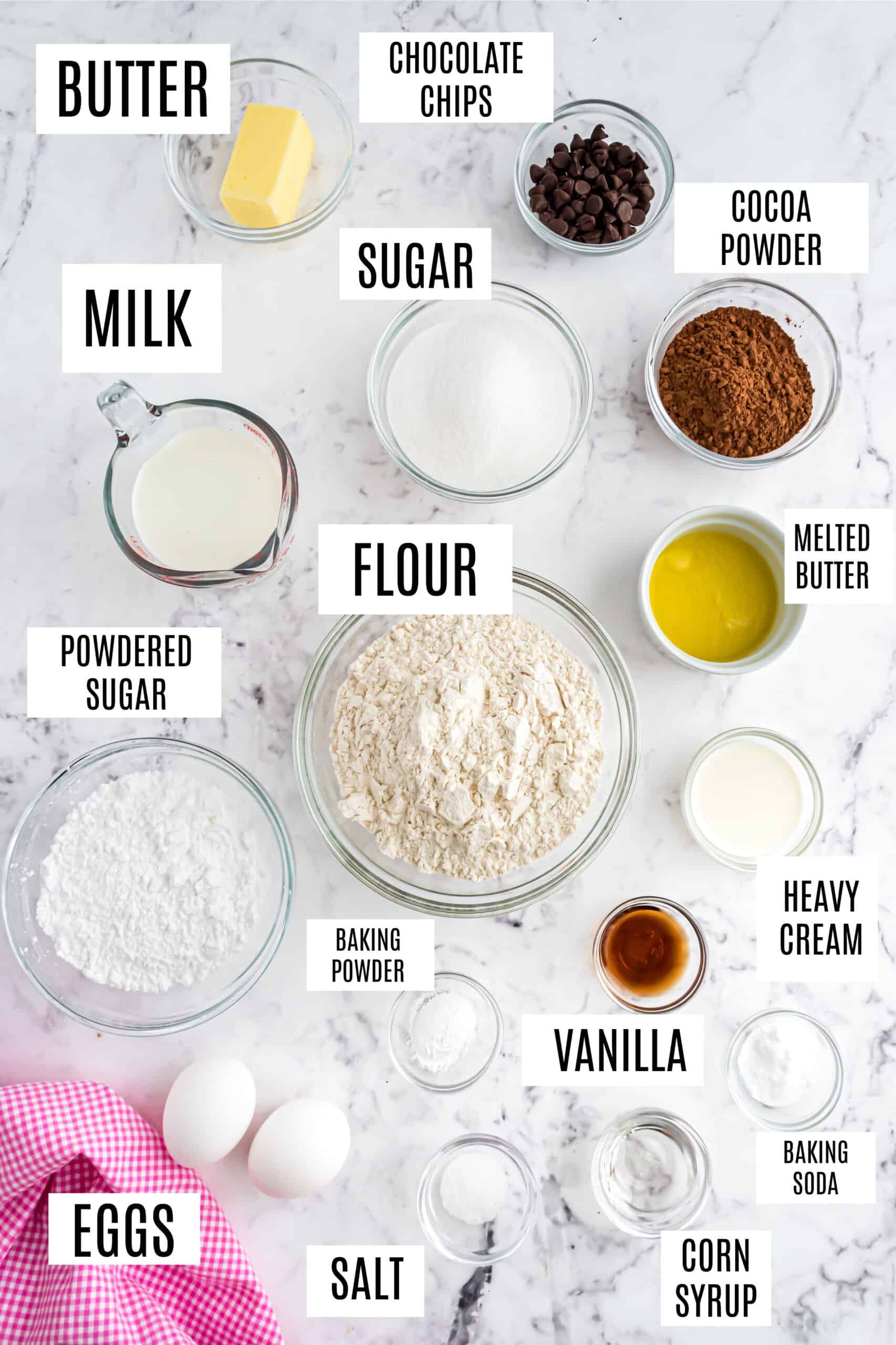 Ingredients needed to make baked chocolate donuts.