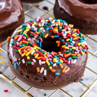 Baked chocolate donut with sprinkles.