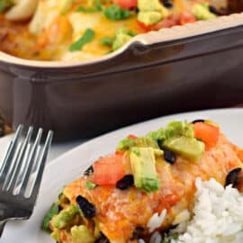 Chicken avocado enchilada served on a plate with cilantro lime rice.