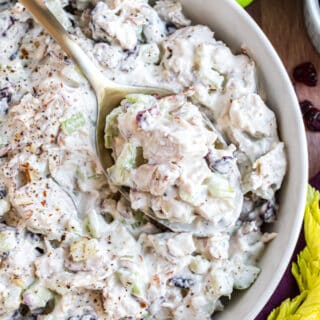 Chicken salad in a white serving bowl.