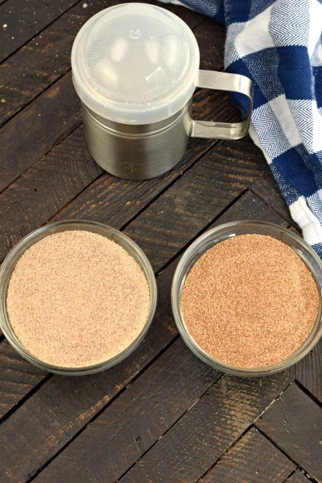 Two strengths of cinnamon sugar mix in two clear glass bowls.