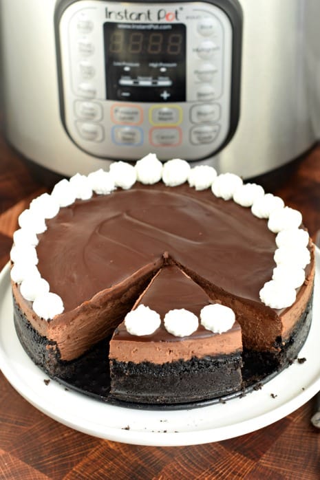 Rich and creamy, this Instant Pot Chocolate Cheesecake is incredible. Oreo crust topped with dark chocolate cheesecake filling and chocolate ganache. Tips and tricks for perfect cheesecake!