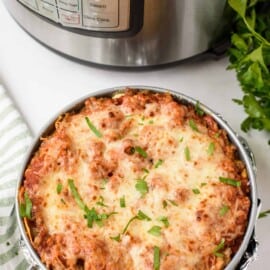 Instant pot lasagna next to instant pot.