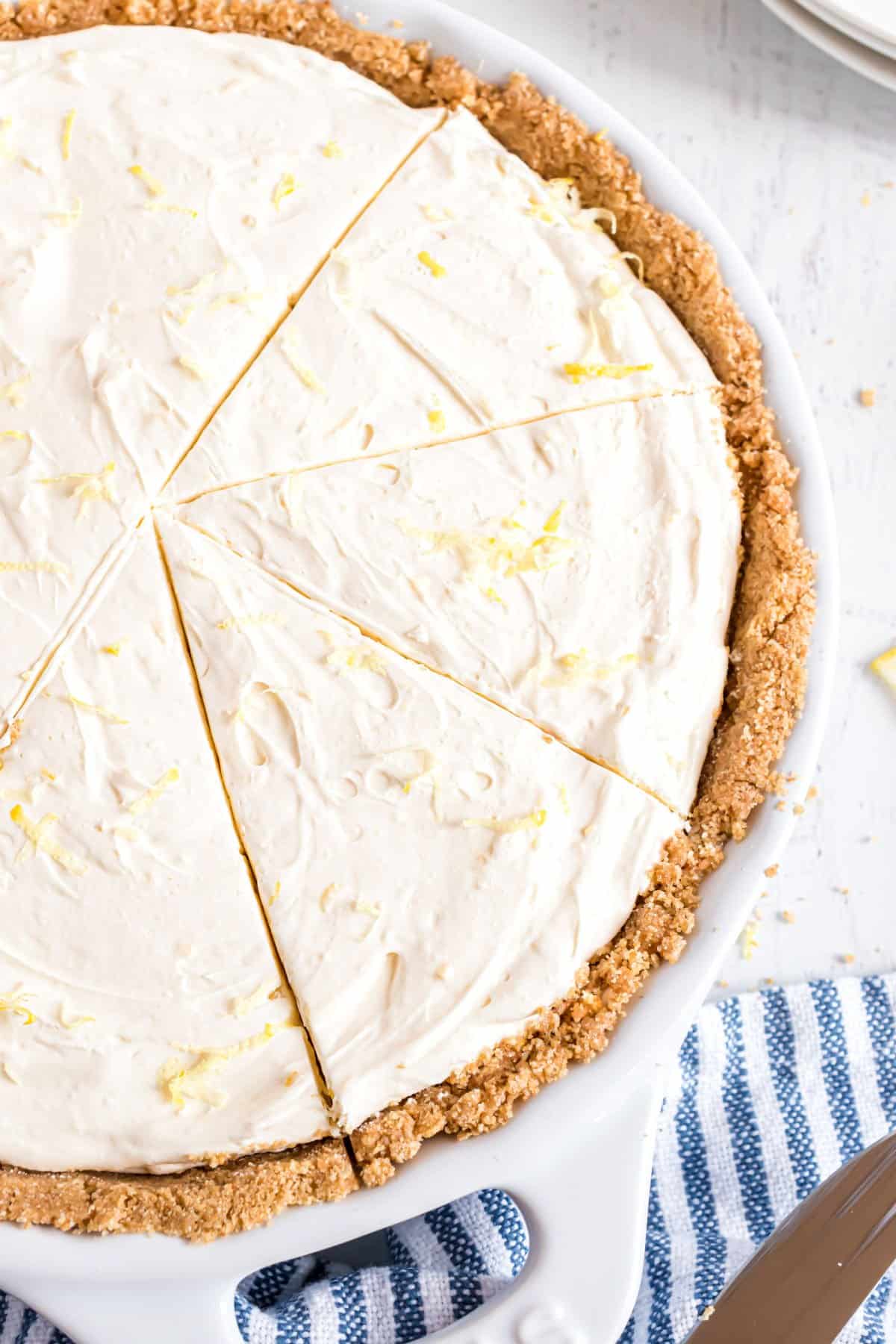 No bake lemon cheesecake cut into slices.