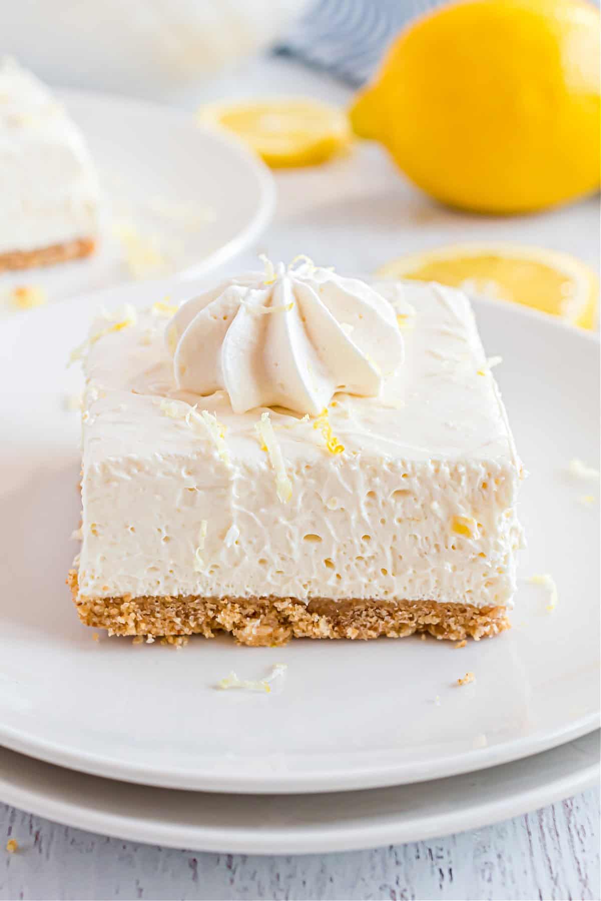 Lemon cheesecake bars cut into squares.