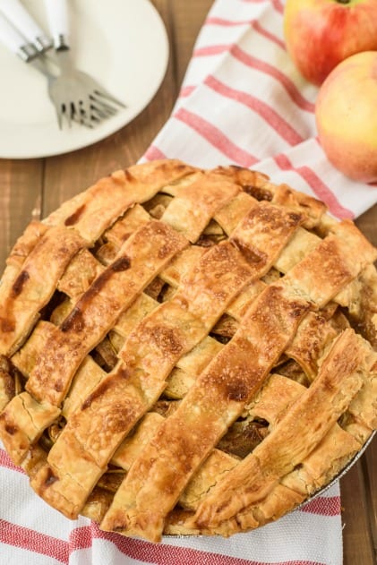 Whole apple pie with lattice crust on top.