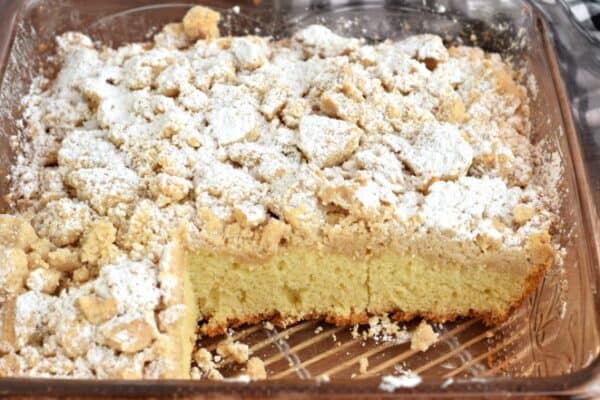 Pan of New York style Crumb Cake with powdered sugar.