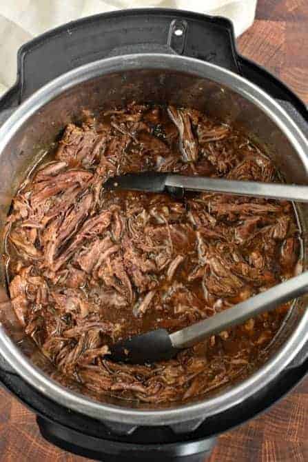 Instant Pot filled with shredded balsamic beef.