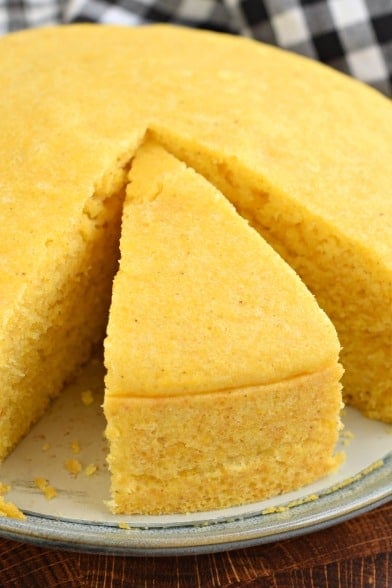 Thick slice of cornbread cut out of the whole pan.