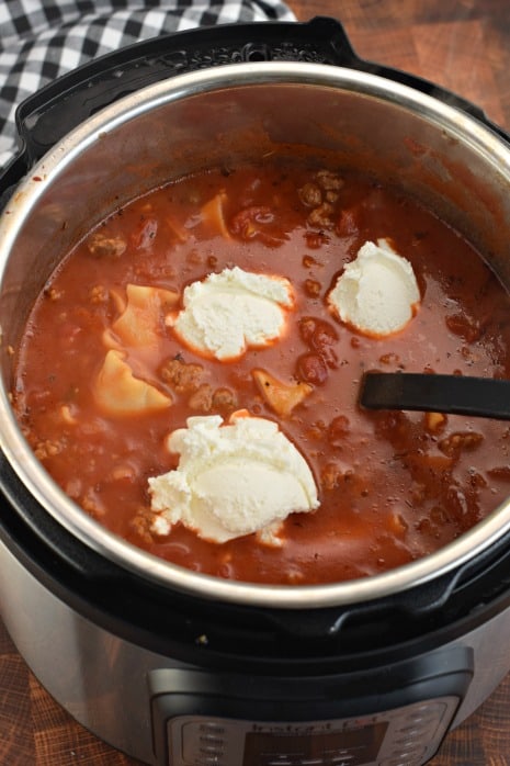 Instant Pot with Lasagna Soup. Topped with dollops of ricotta cheese.