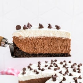 Slice of rich chocolate cheesecake on a spatula.