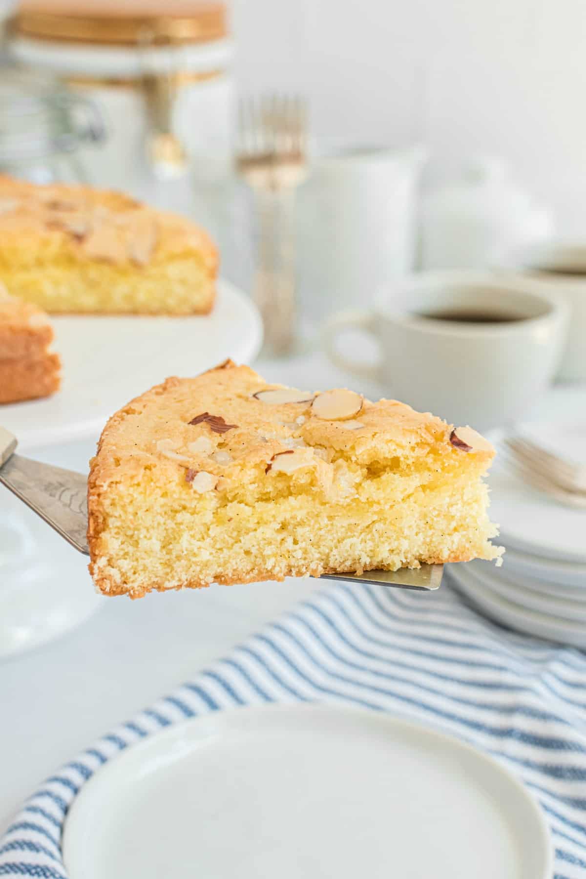 Slice of almond cake on a pie server.