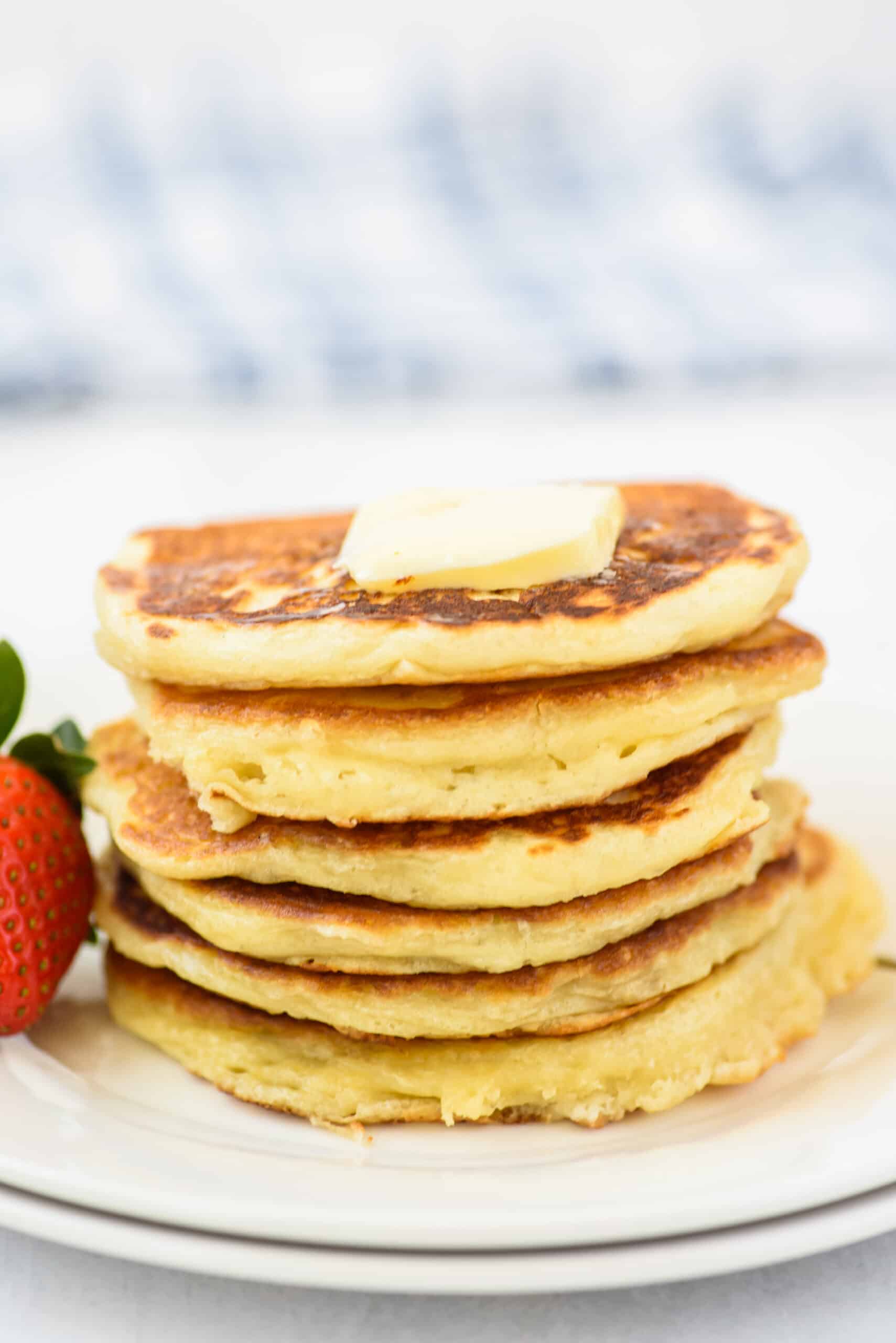 Stack of thick and fluffy buttermilk pancakes.