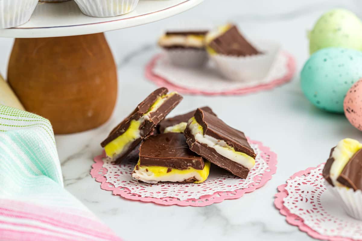 Three pieces of cadbury egg fudge served on a doily.