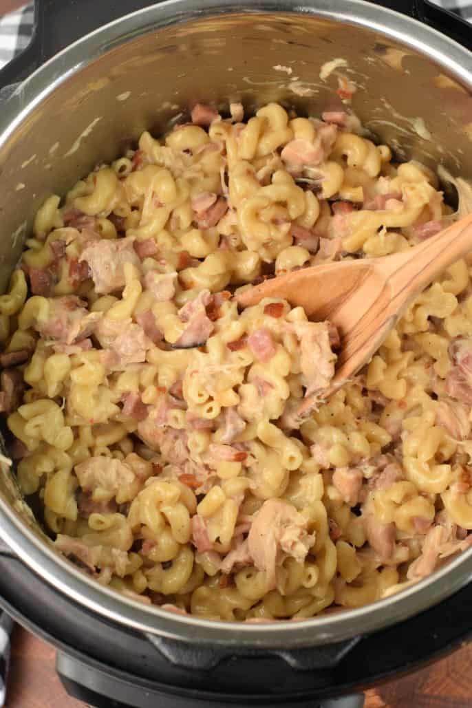 Instant Pot with pasta, chicken, ham, bacon, cheese to make chicken cordon bleu.