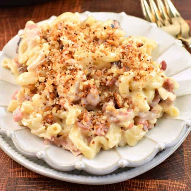 Chicken Cordon Bleu pasta on white scalloped plate.