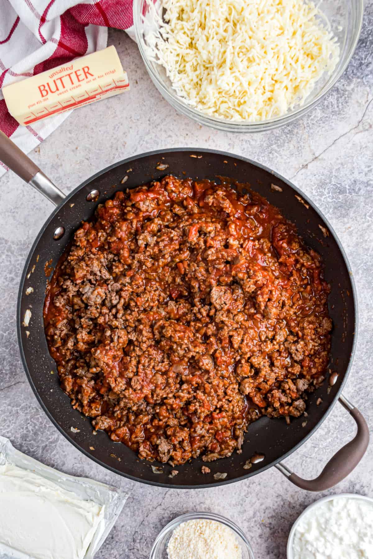 Meat spaghetti sauce in skillet for spaghetti casserole.