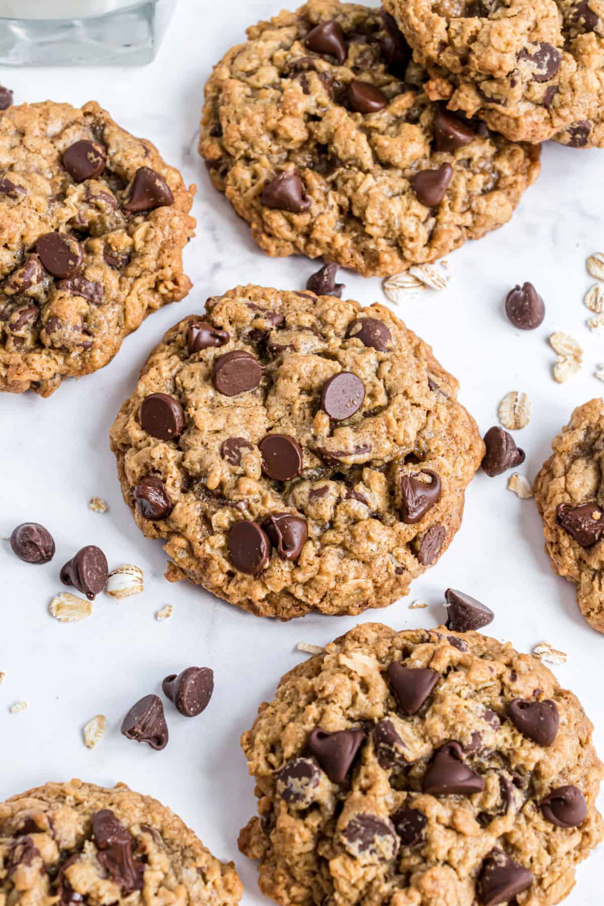 Oatmeal chocolate chip cookies on parchment paper.