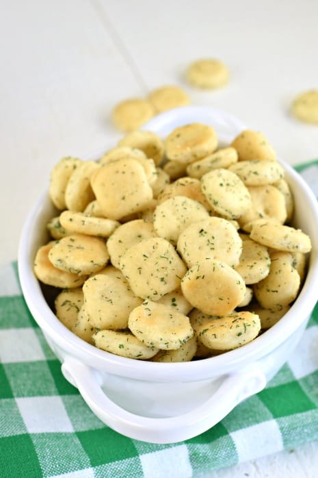 White bowl with ranch seasoned oyster crackers and green napkin.