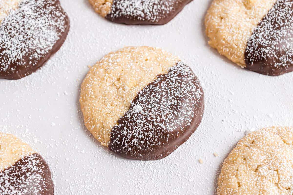 Potato chip cookies with chocolate and powdered sugar.