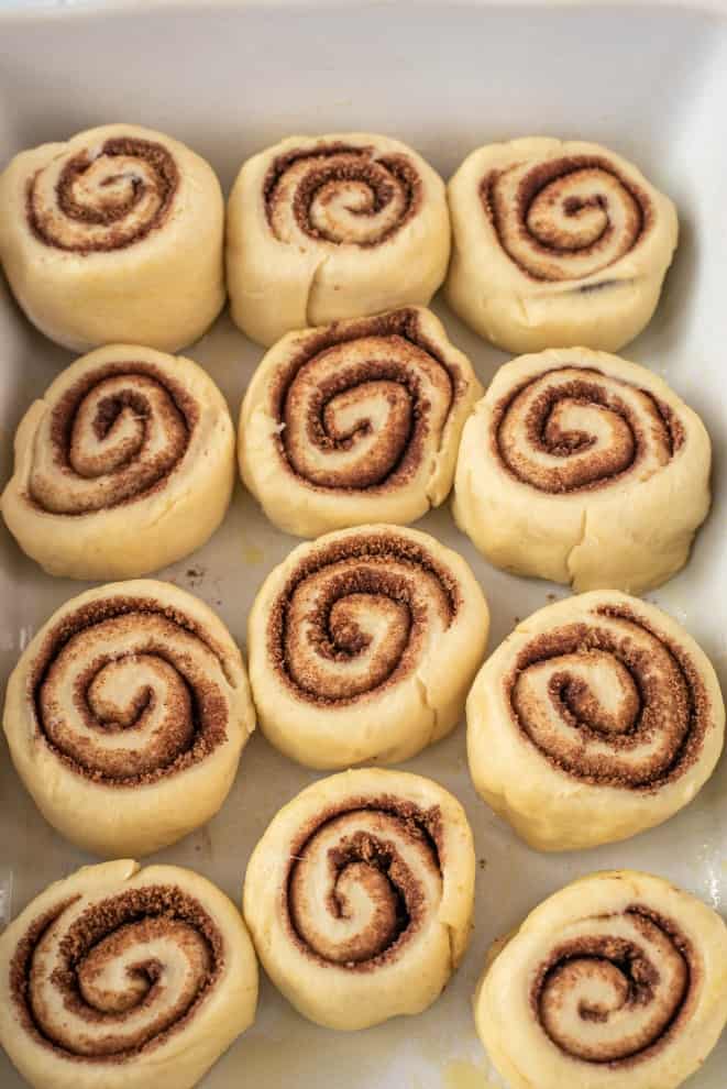 Pan of cinnamon rolls doubling in size before baking.