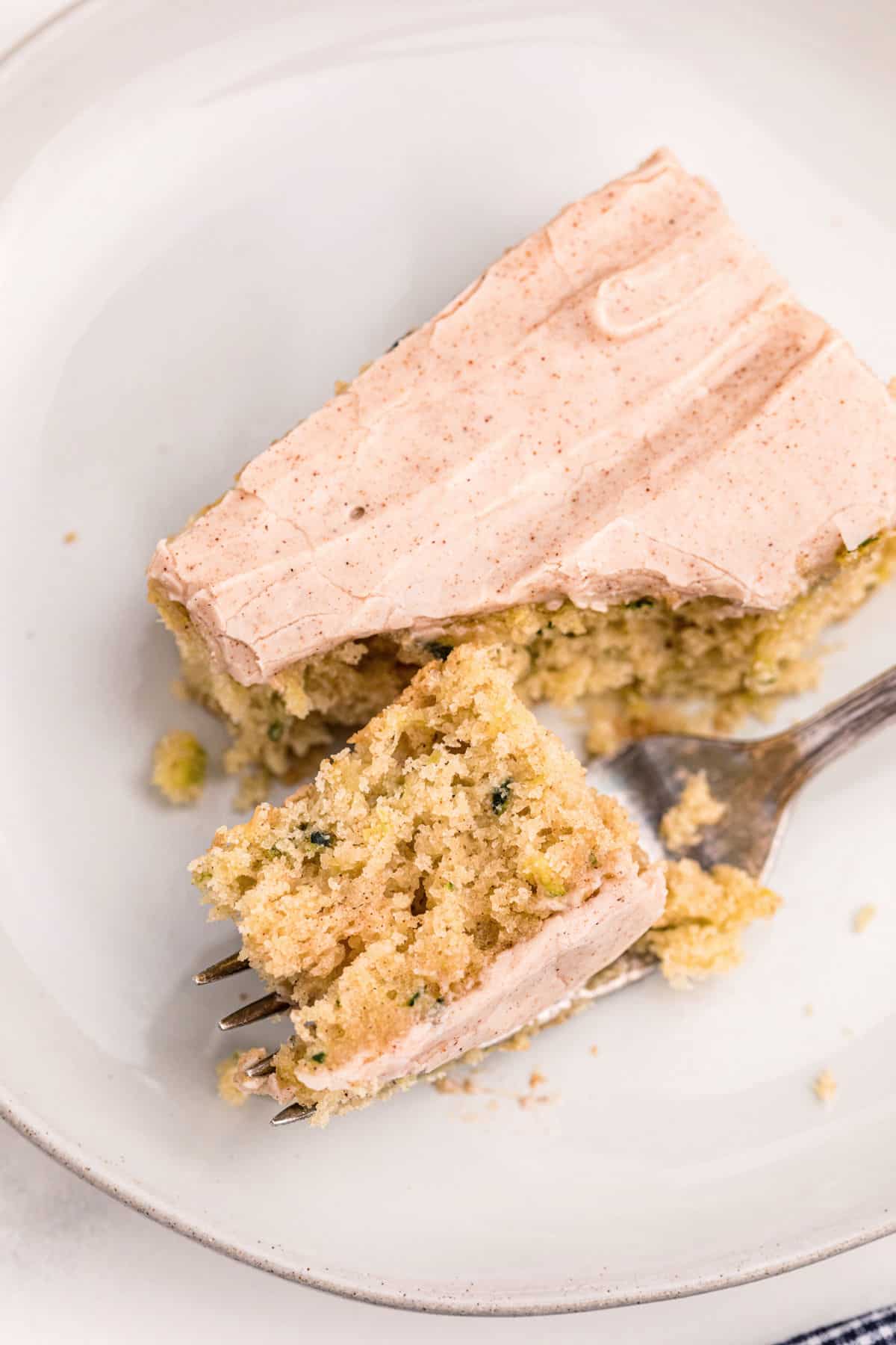 Bite of zucchini bars on a fork.