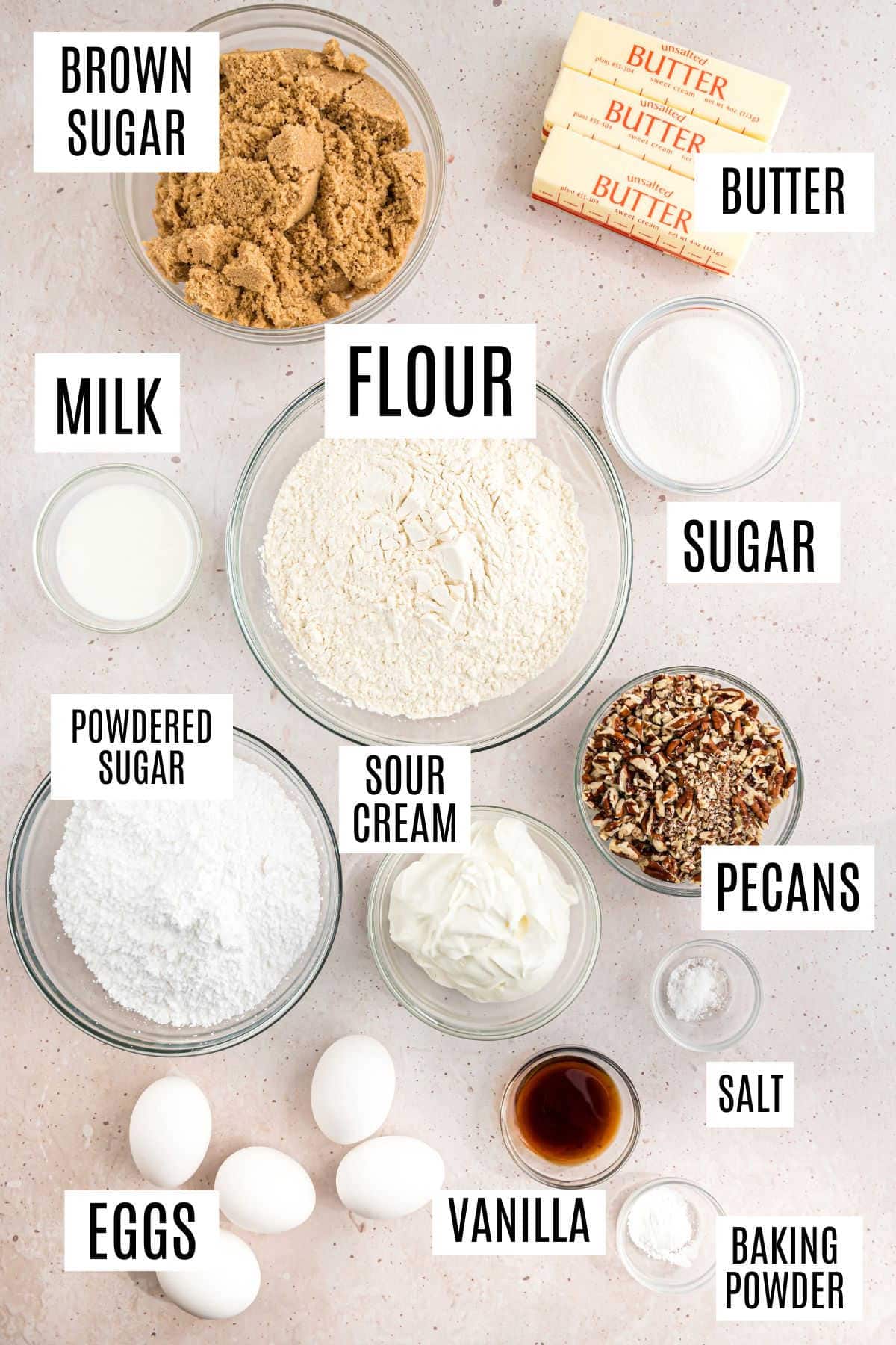Baking ingredients labeled: brown sugar, butter, flour, sugar, milk, powdered sugar, eggs, sour cream, pecans, vanilla, salt, and baking powder—everything needed for a rich brown sugar pound cake.