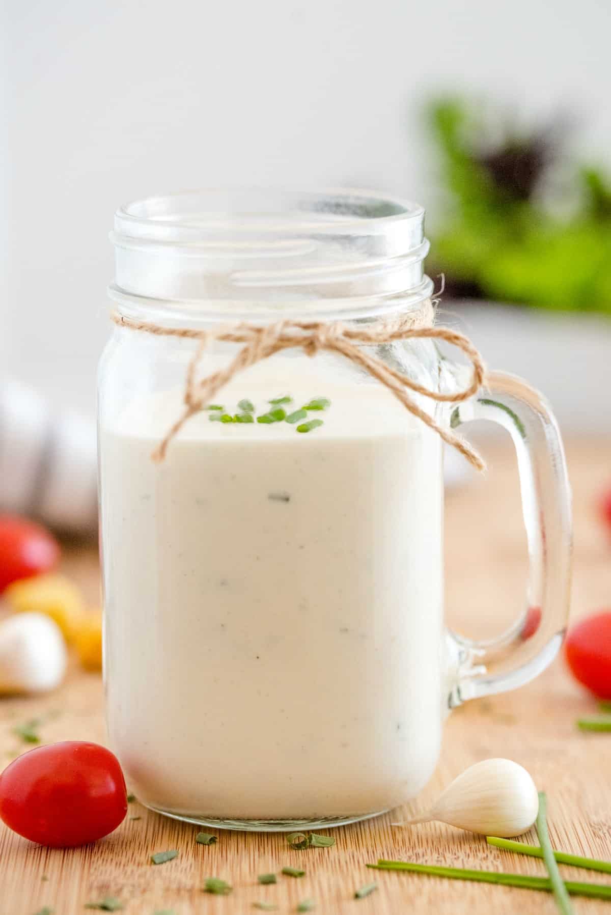 Mason jar mug filled with ranch dip.