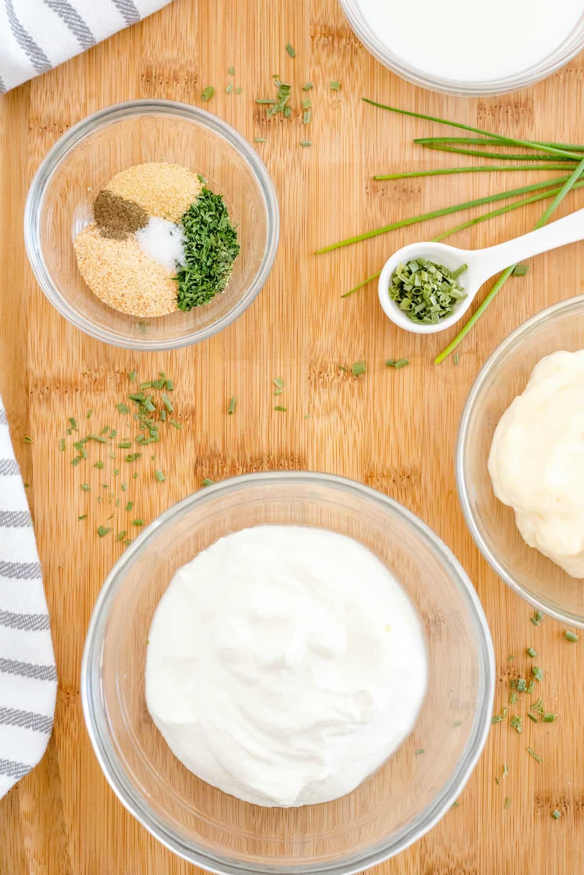 Ingredients needed for homemade buttermilk ranch dressing.