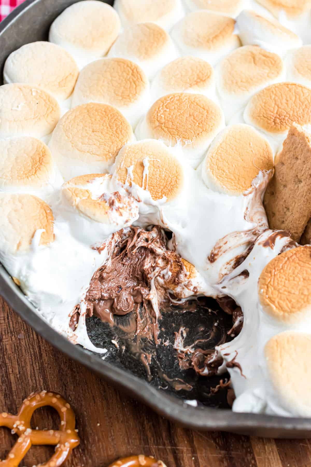 Gooey chocolate and marshmallow in cast iron skillet.