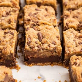 Toffee chocolate chip layered cookie bars cut into squares.