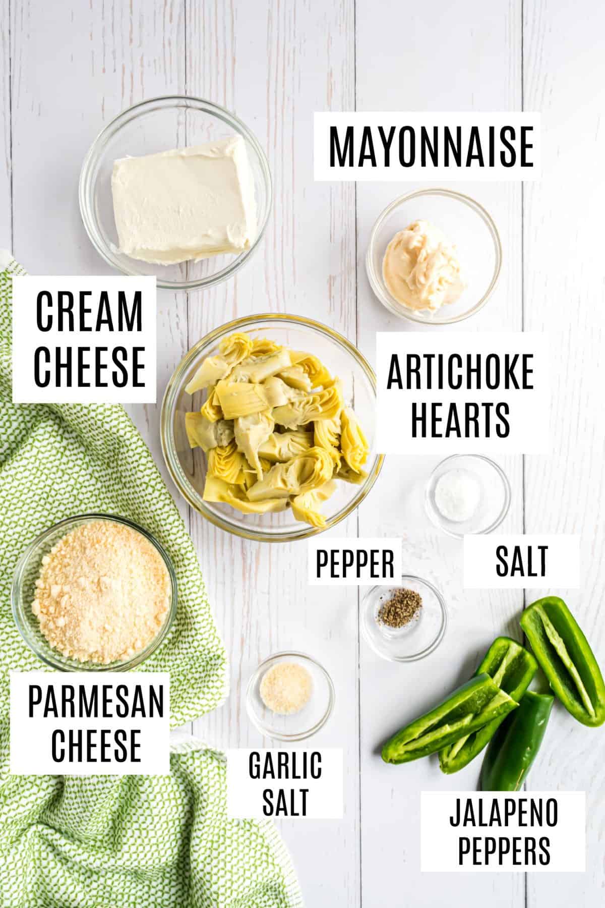 Ingredients needed to make artichoke jalapeno dip.